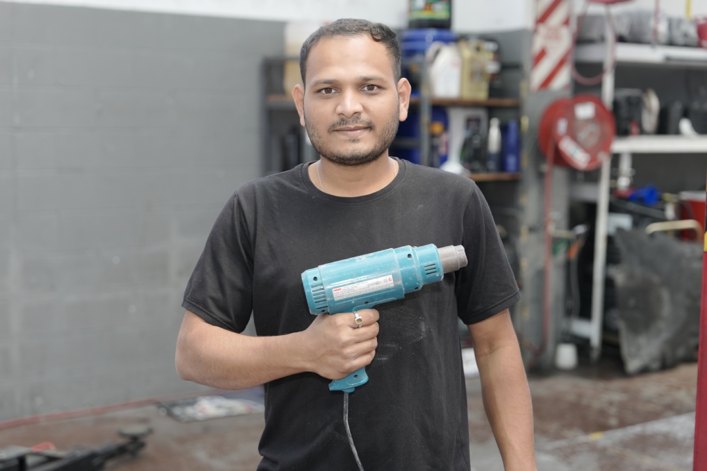 Atmiya Auto Center technician in the Avondale workshop